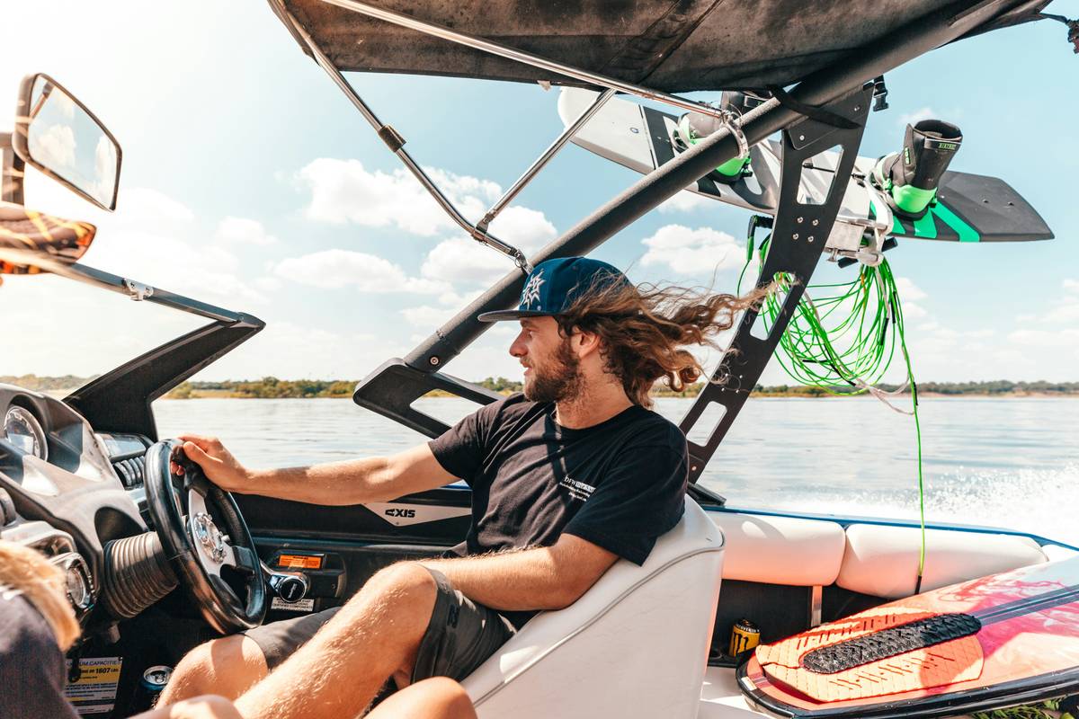 renter liability insurance for boat document being reviewed beside a rental boat at marina